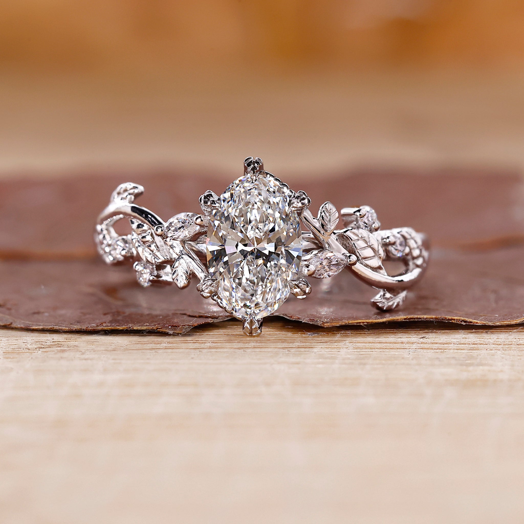 Oval Cut Diamond Ring designed with vine style detail.