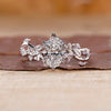 Oval Cut Diamond Ring designed with vine style detail.