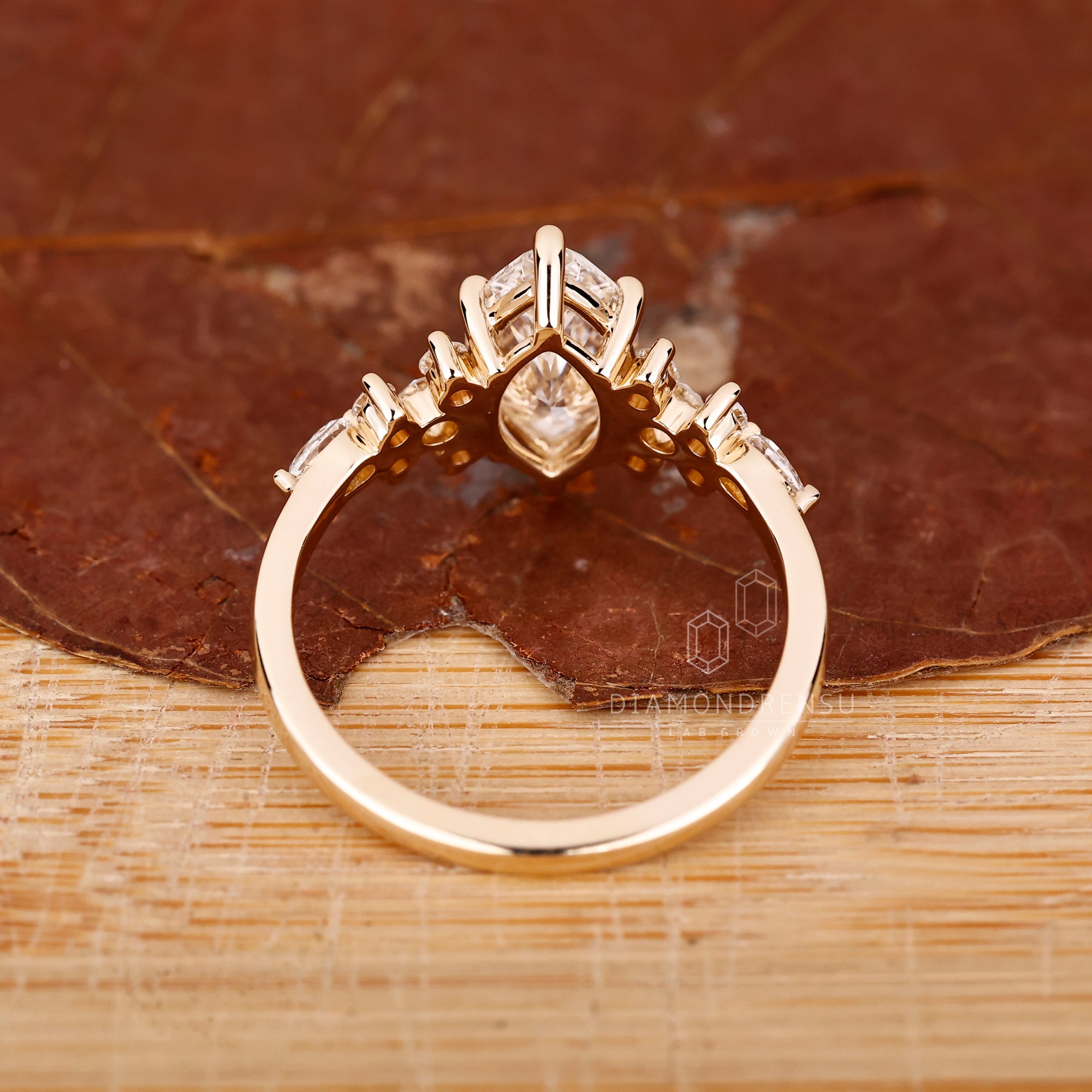 6 prong setting ring featuring marquise cut center.
