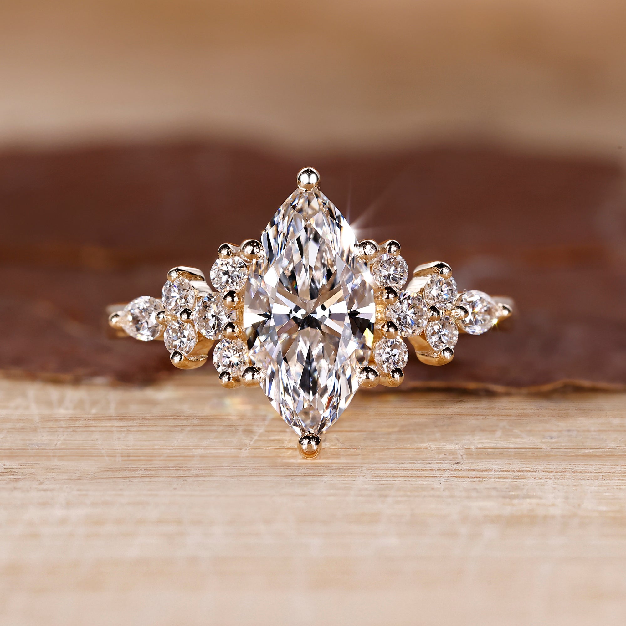 Marquise cut ring with round and pear side stones.
