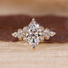 Marquise cut ring with round and pear side stones.
