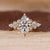 Marquise cut ring with round and pear side stones.
