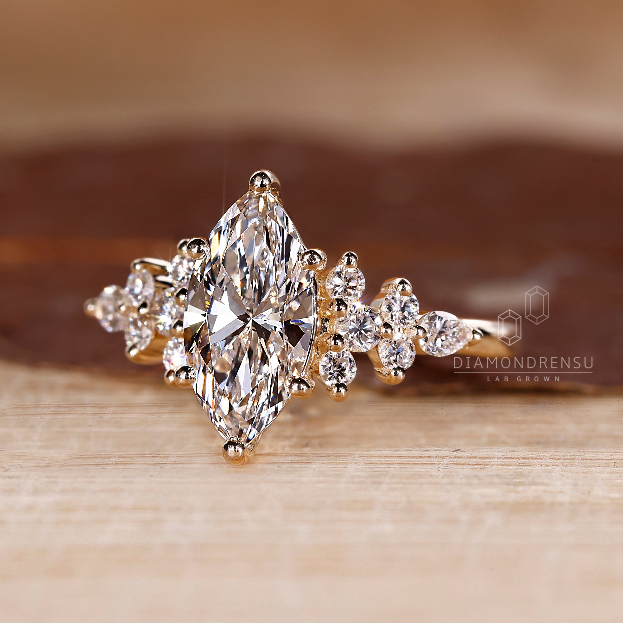 Muse setting with marquise cut and side stones.

