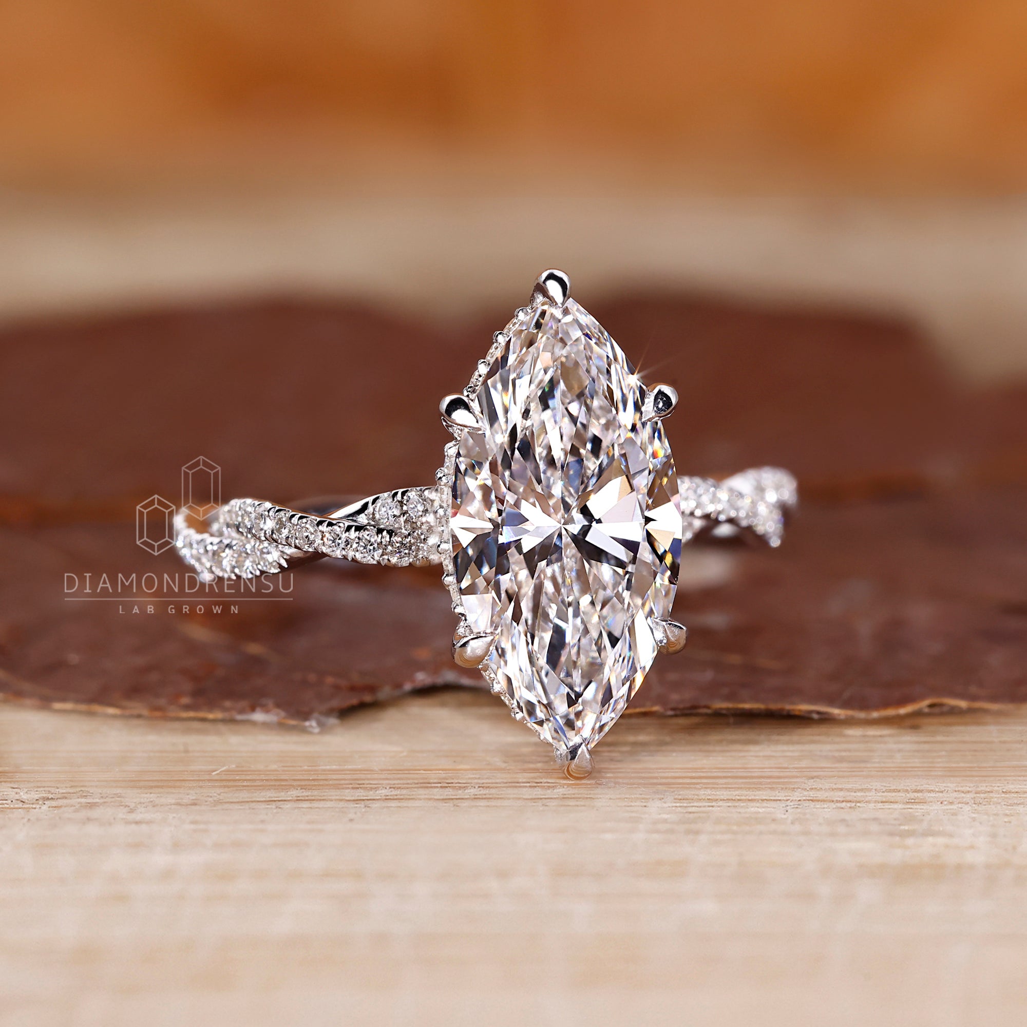 6 prong claw setting secures the marquise center.
