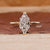 Dutch marquise diamond engagement ring crafted in cathedral setting.