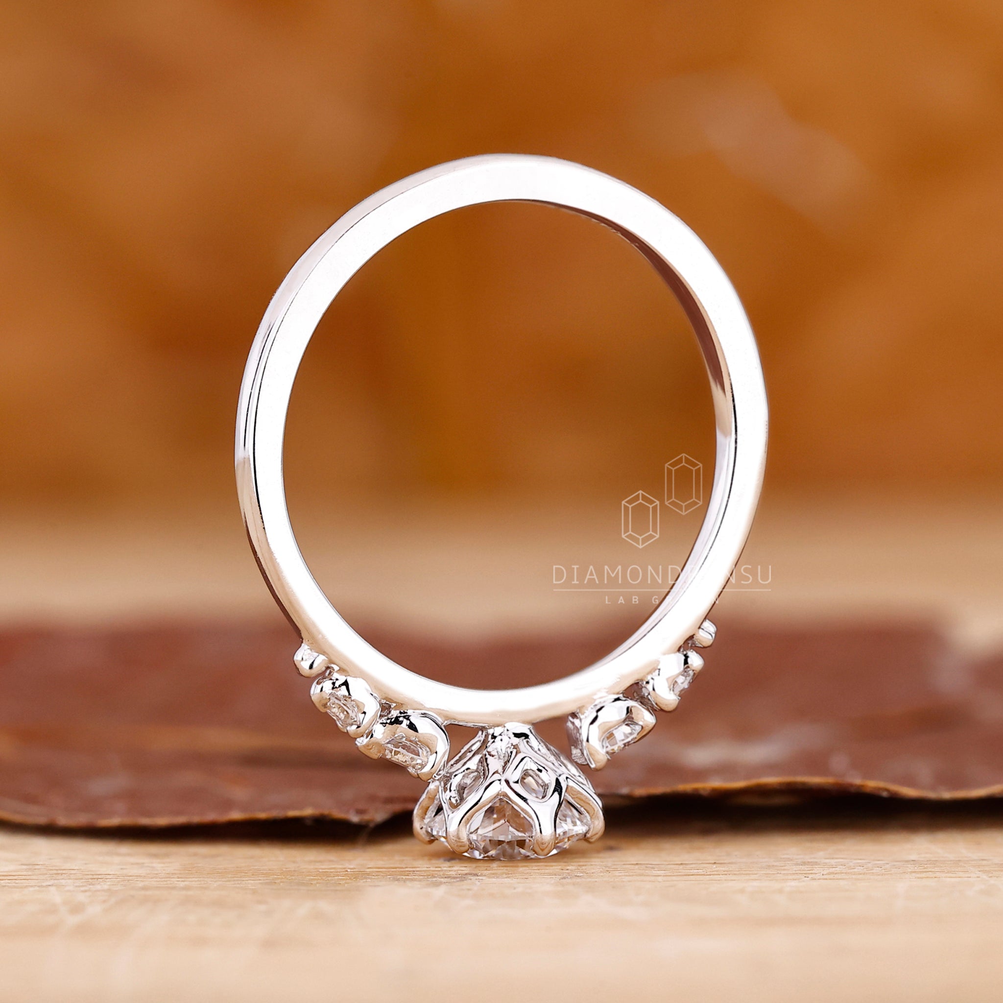 Custom engagement ring crafted in tapered shank band design.
