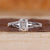 Emerald cut diamond ring in a sleek design.
