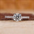 Round cut engagement ring with pave setting.
