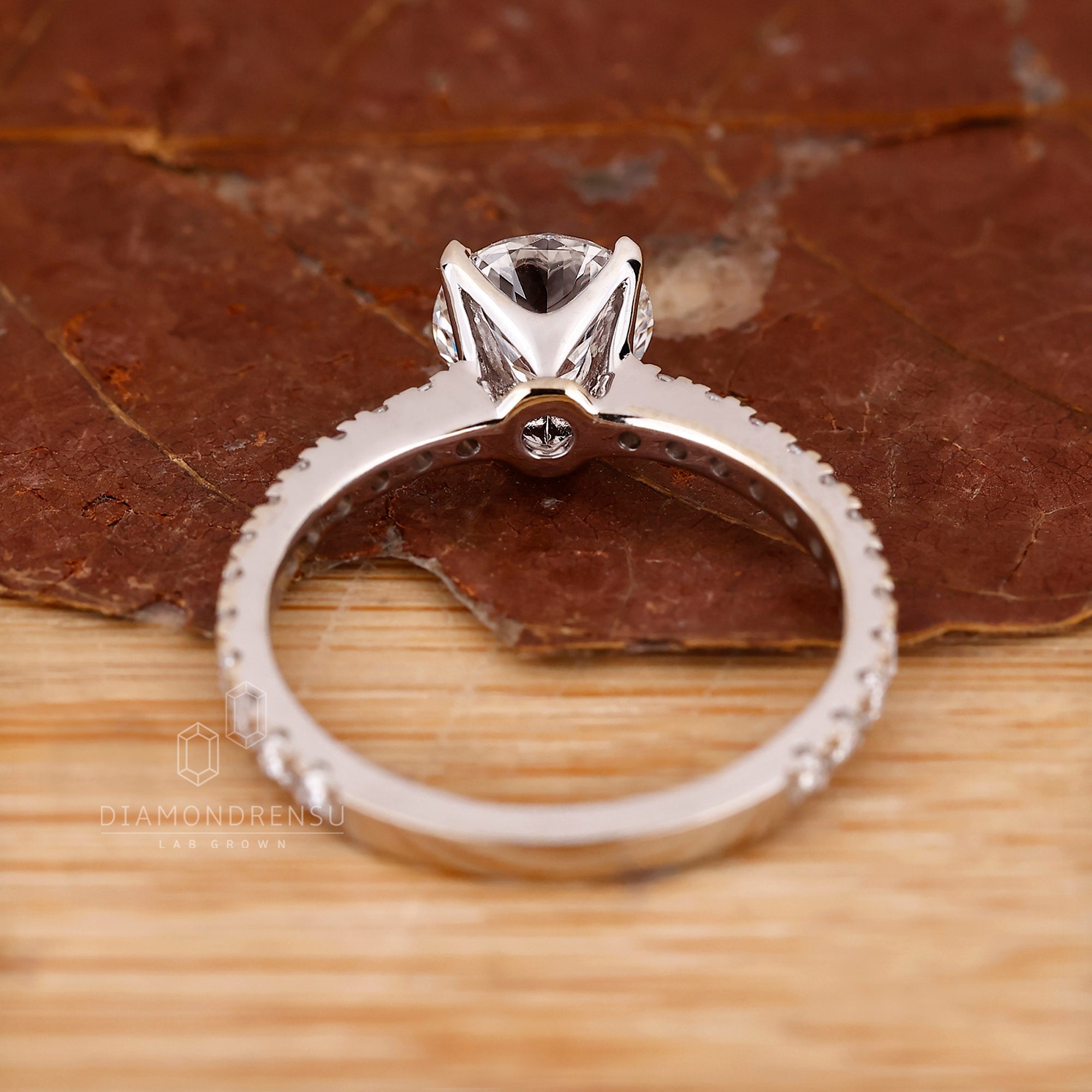 Buy engagement ring featuring round diamond.
