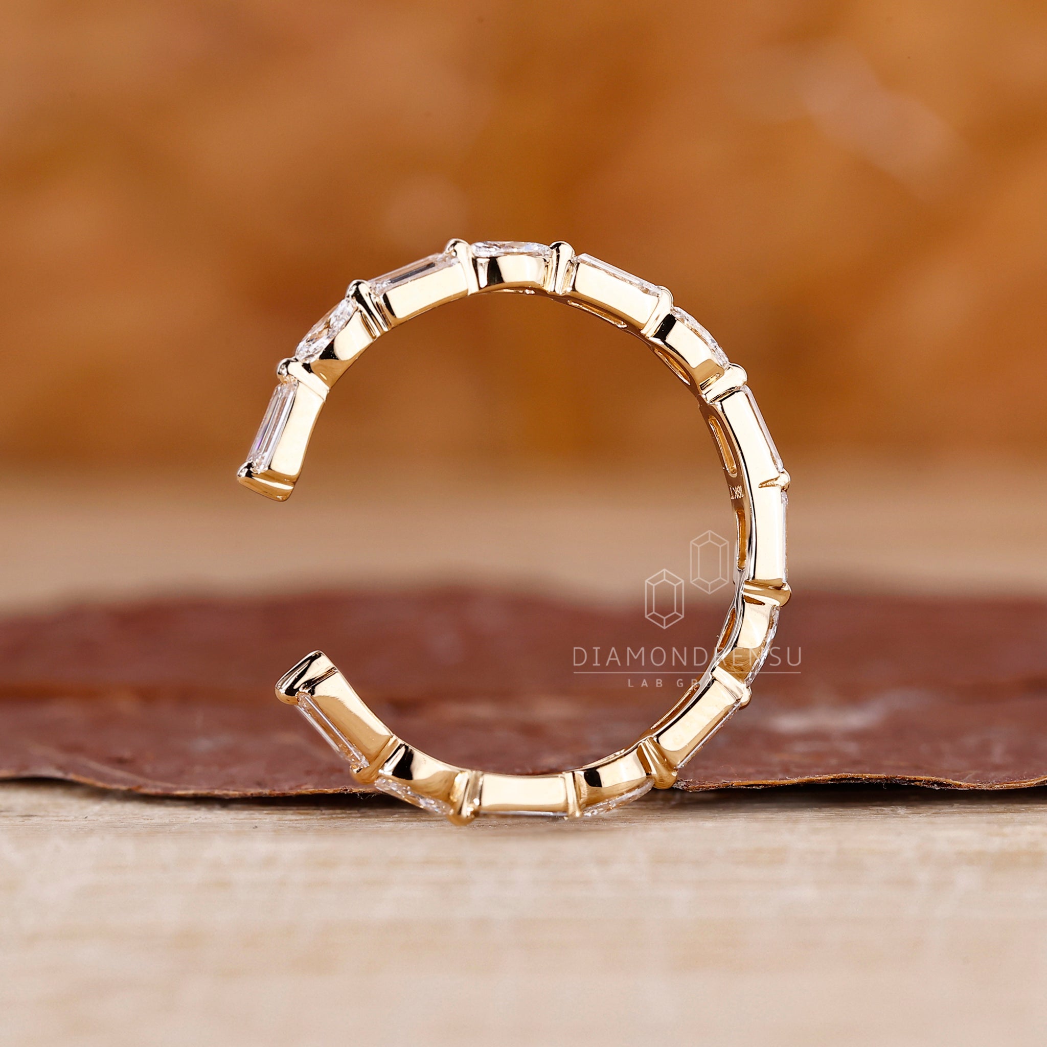 Shared prong wedding band with lab grown marquise diamonds.