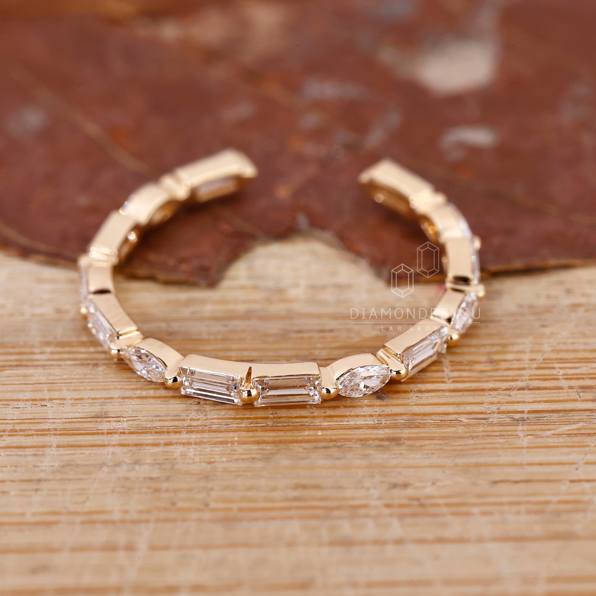 Handmade band featuring a shared prong setting for secure fit.