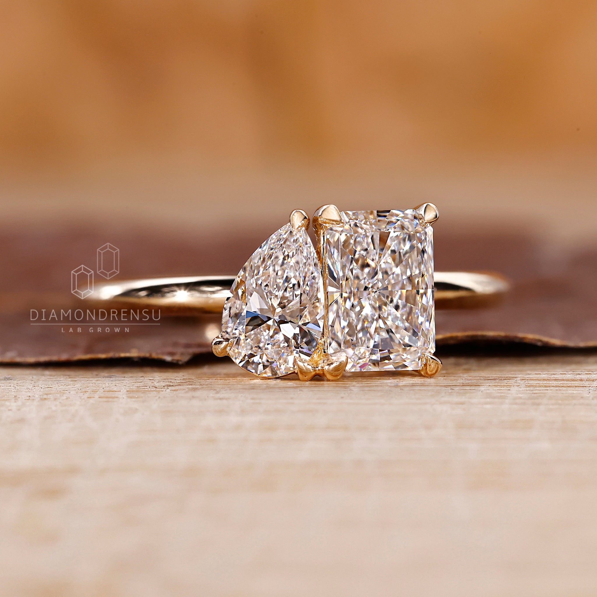 Diamond Ring designed with radiant and pear cut stones.