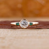 Bezel Three Stone Engagement Ring crafted in yellow gold engagement ring.