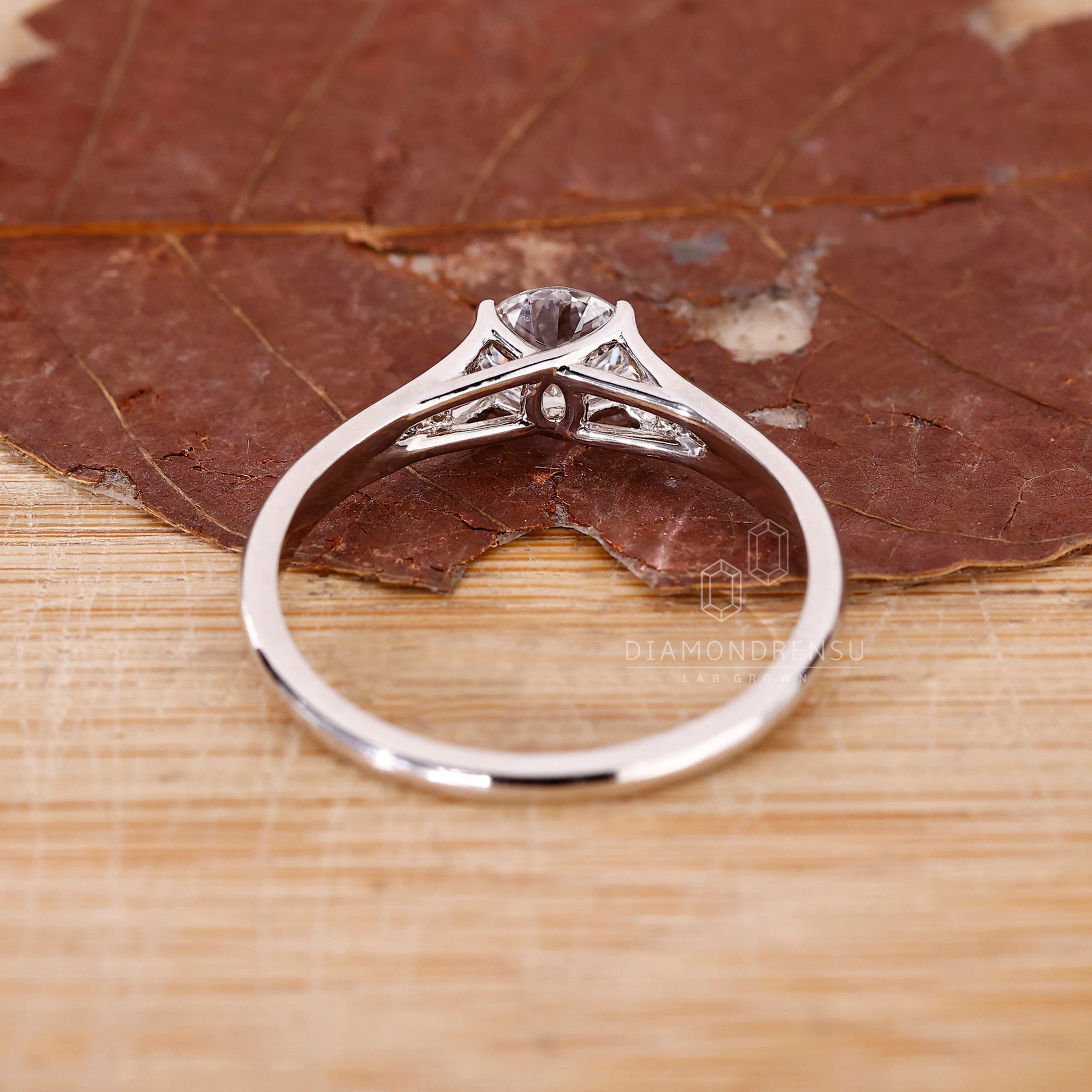 Custom engagement ring with round diamond setting.
