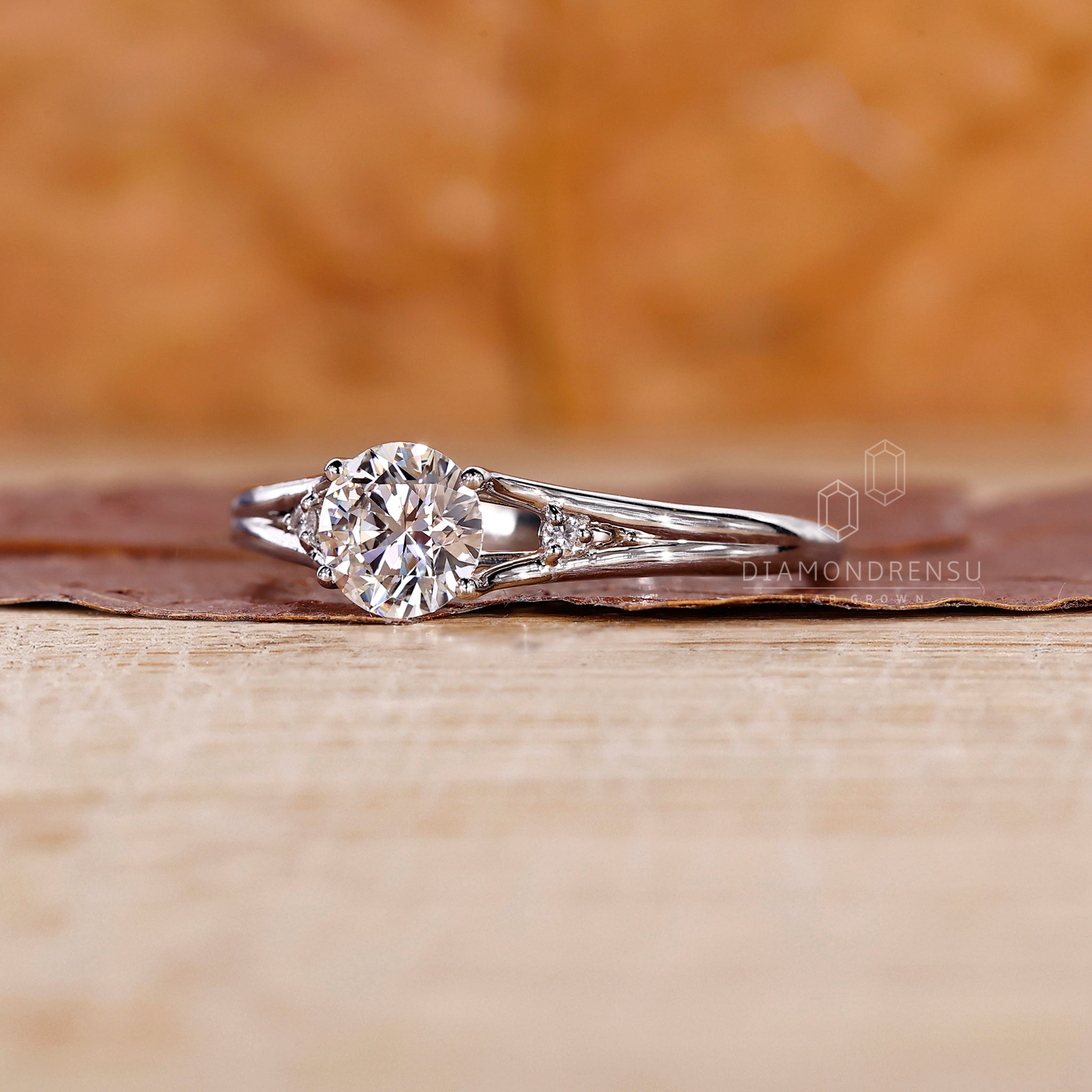 3 stone diamond ring with split shank ring finish.
