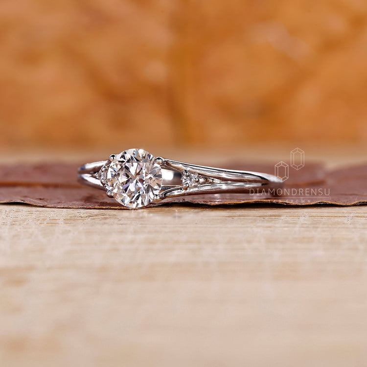 3 stone diamond ring with split shank ring finish.
