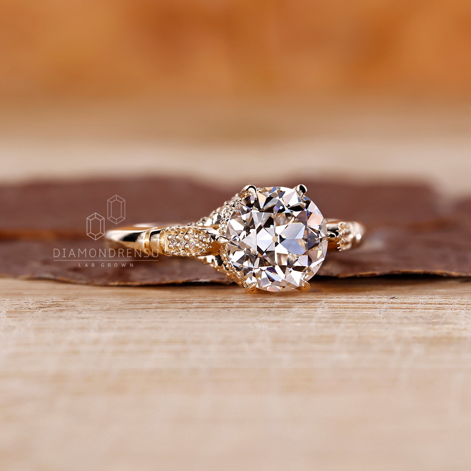 Yellow gold engagement ring with six prong setting.
