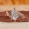 Nature inspired engagement ring with leaf-style pave