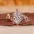 Nature inspired engagement ring with leaf-style pave