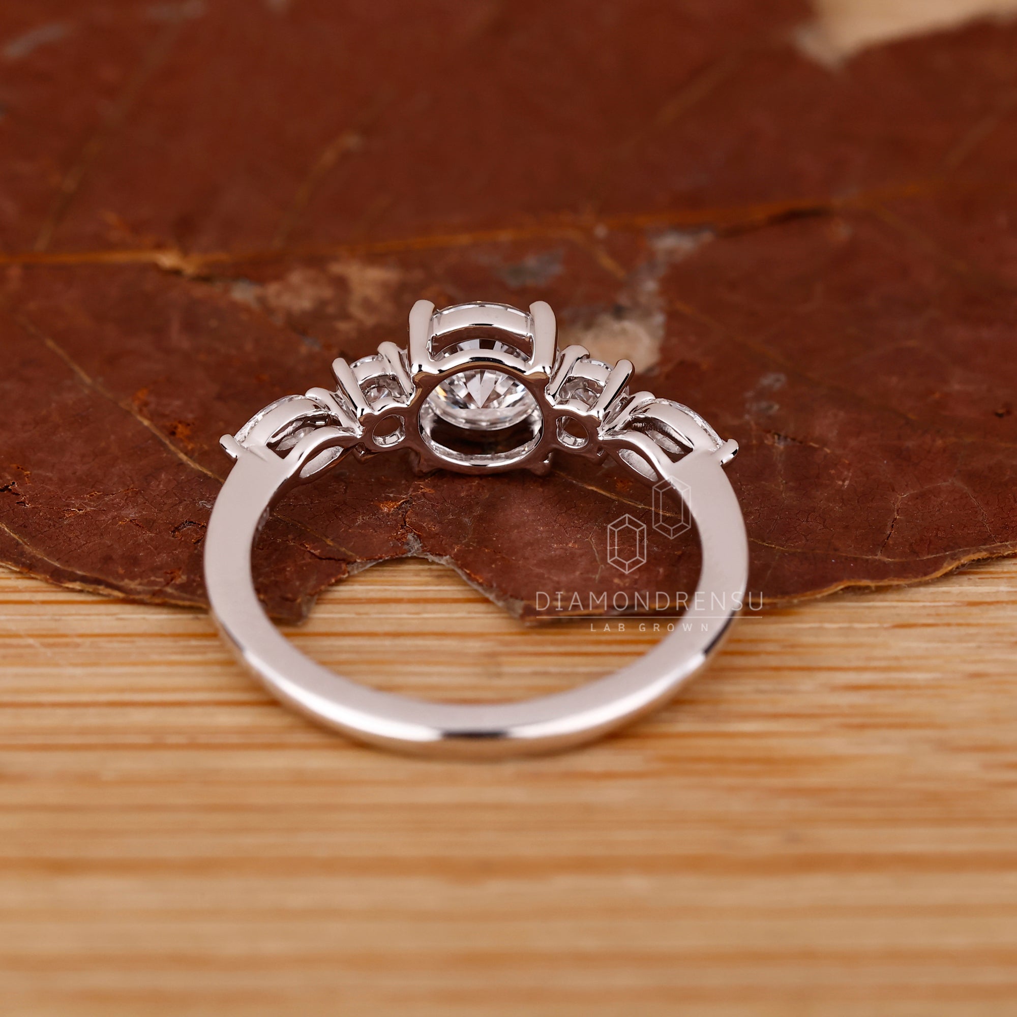 White gold engagement ring with marquise and round mix.
