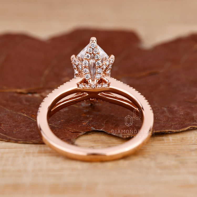 Diamondrensu UK engagement ring featuring Dutch marquise center stone.