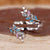 Diamondrensu band with round and marquise cut gemstones.
