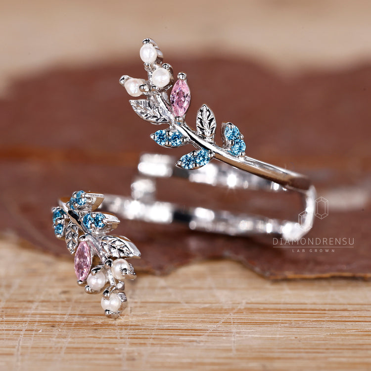 Marquise and round cut wedding band featuring intricate gemstone accents.
