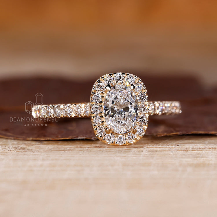 Yellow gold diamond ring with a halo layout.
