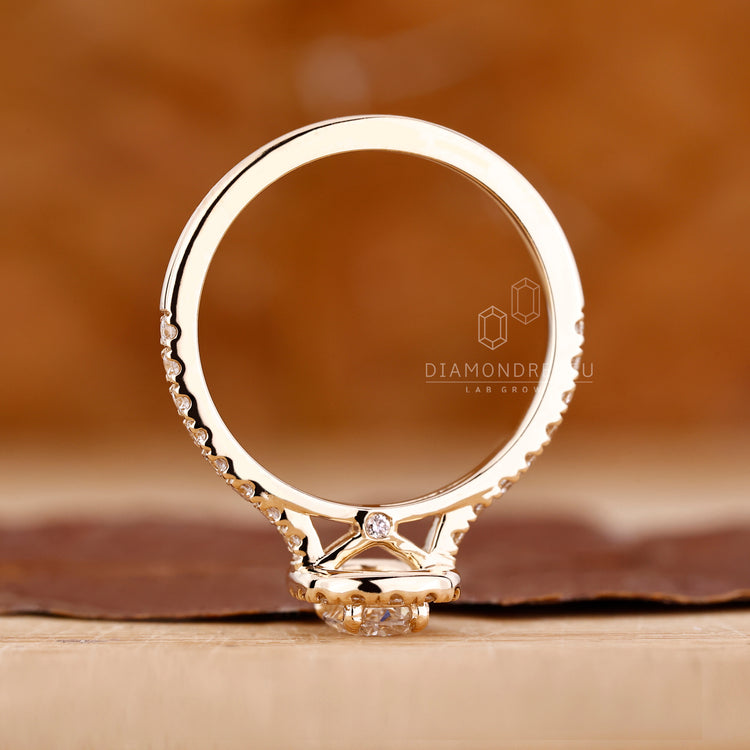 Lab Grown Diamond in a yellow gold cathedral band.
