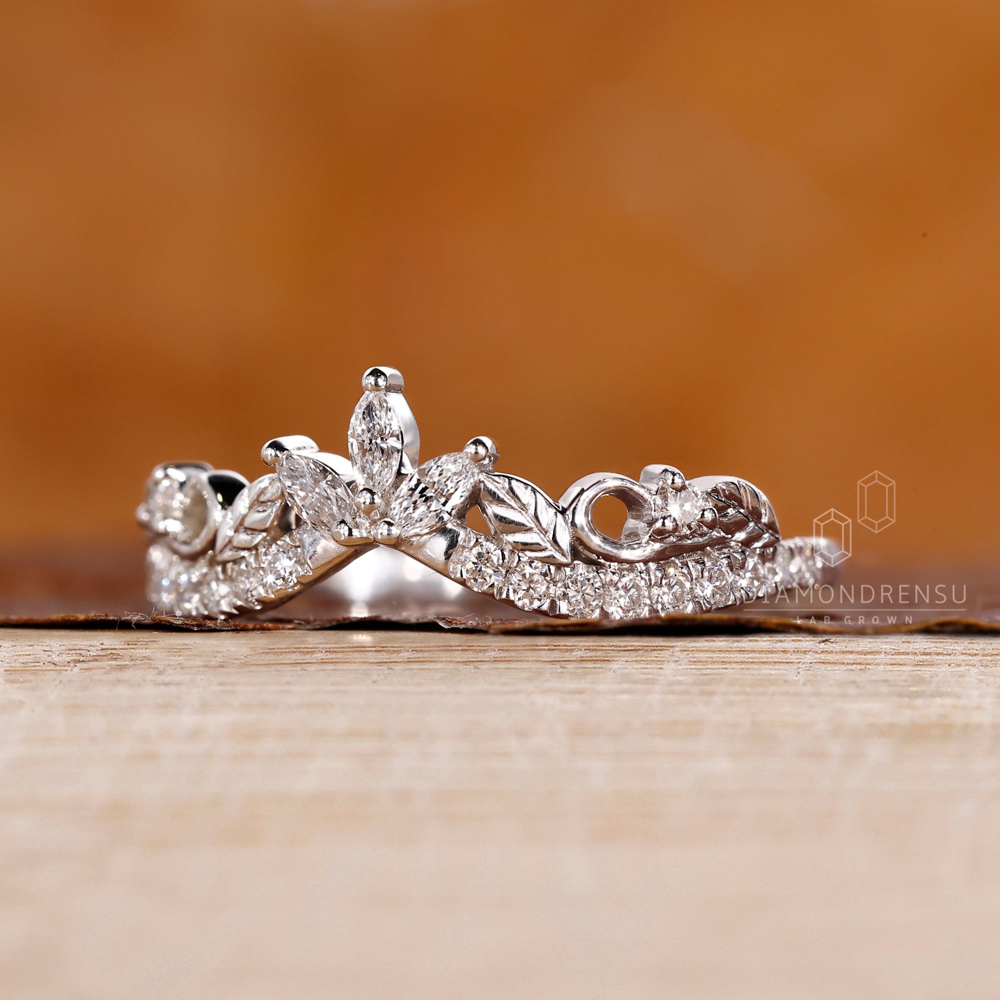 Nature inspired wedding band with marquise and round mix.
