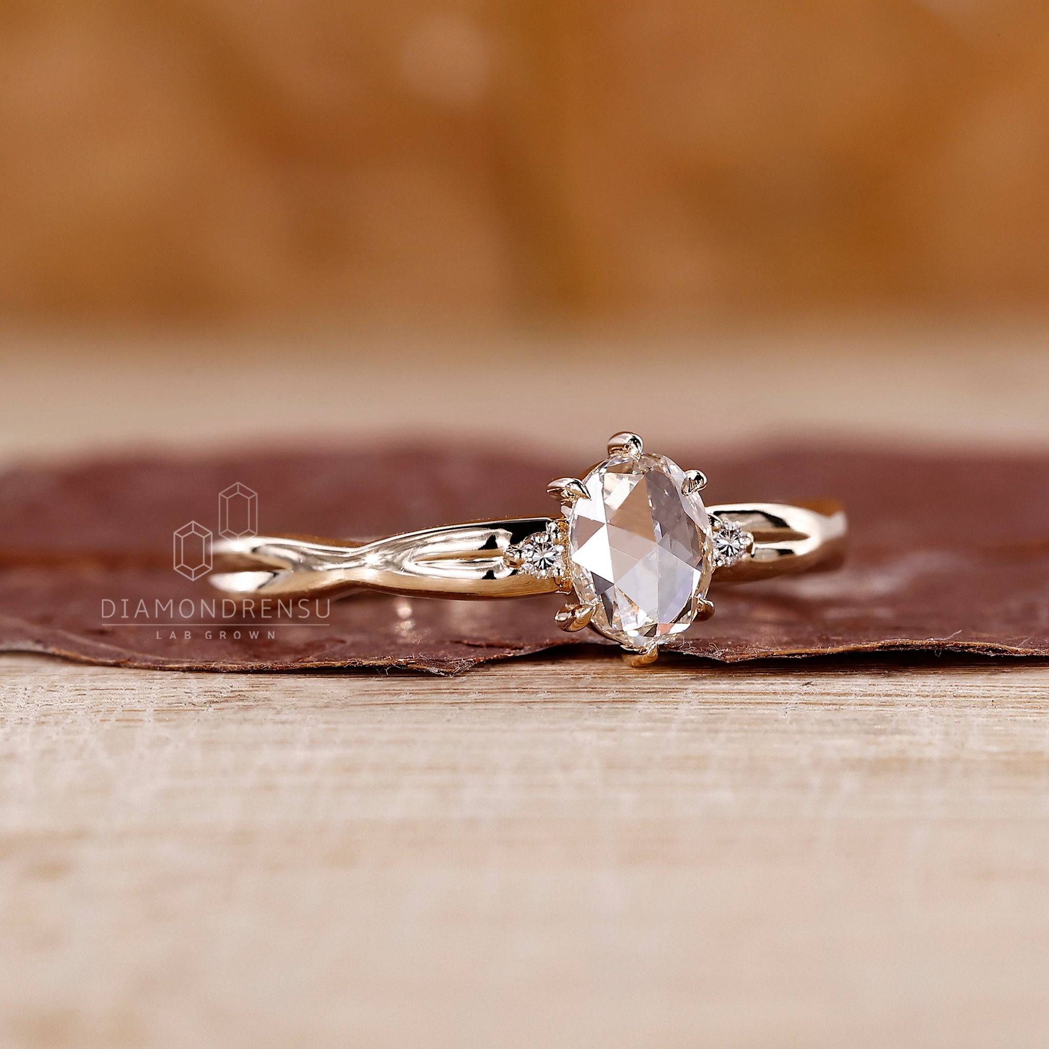Prong setting ring with oval and round stones