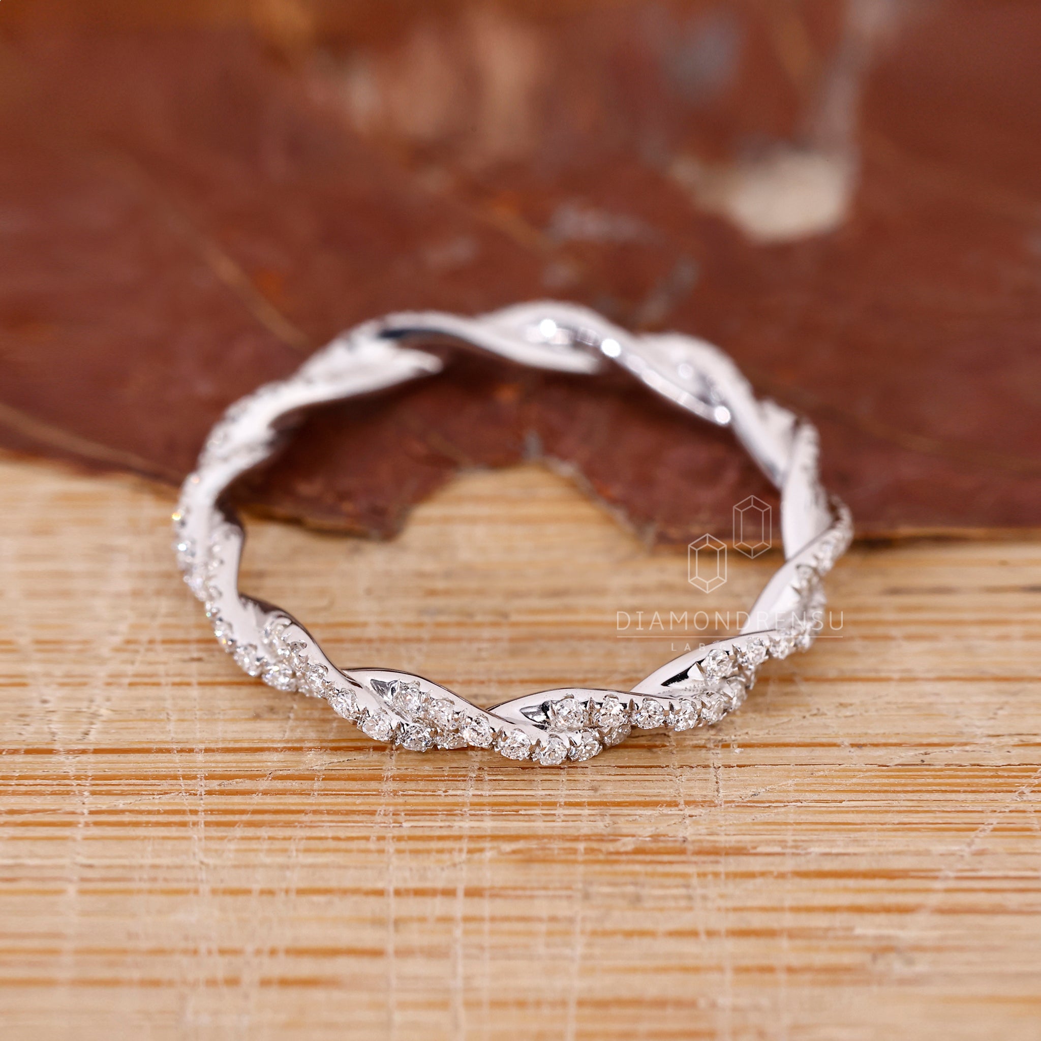 White gold wedding band with a modern twisted design.