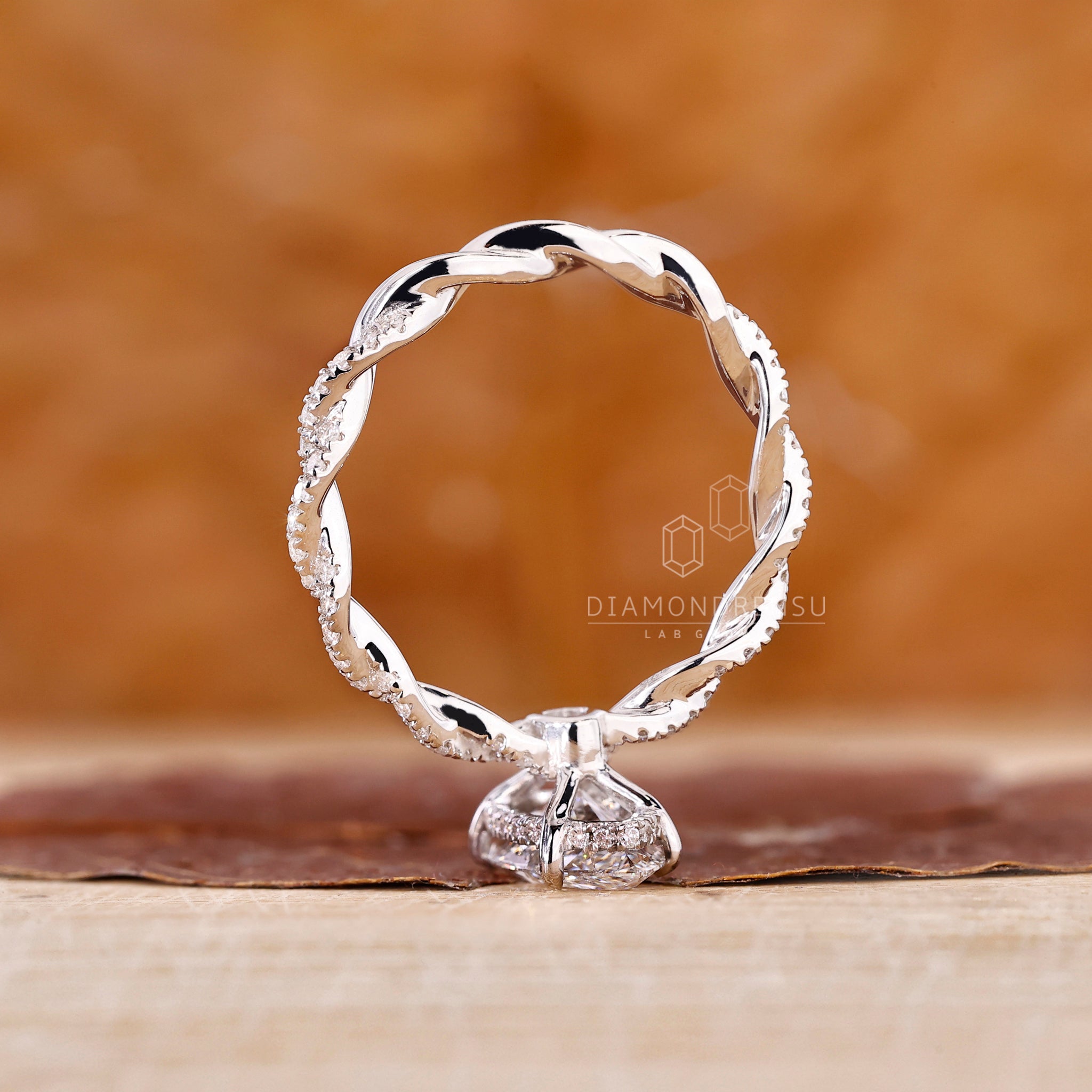 UK engagement ring in diamond twist engagement ring style.
