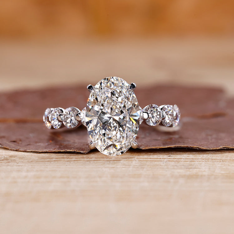 Oval diamond ring crafted with floating bubble prong setting.