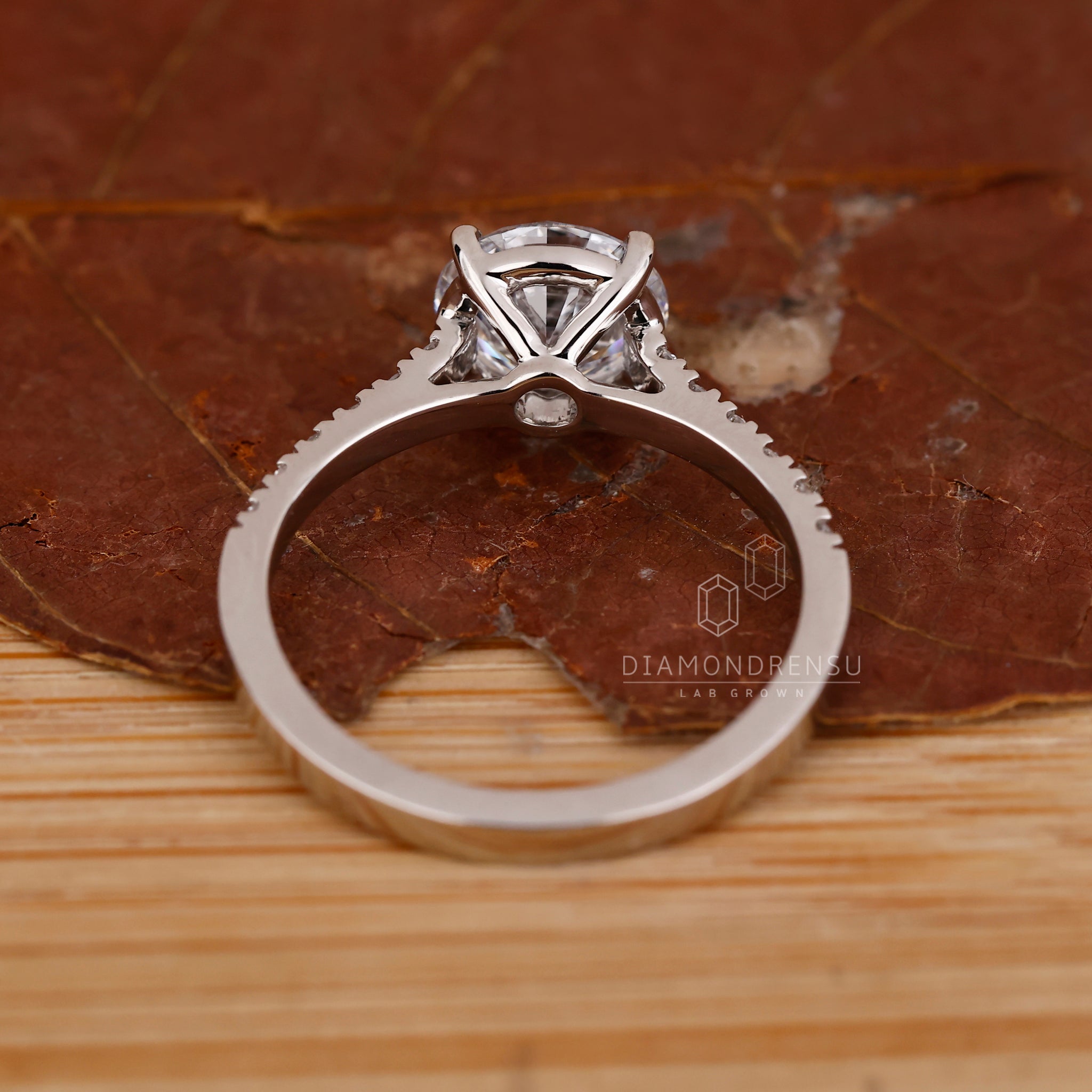 Handmade white gold engagement ring with round diamond