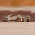 Cluster wedding band with marquise and round diamonds.
