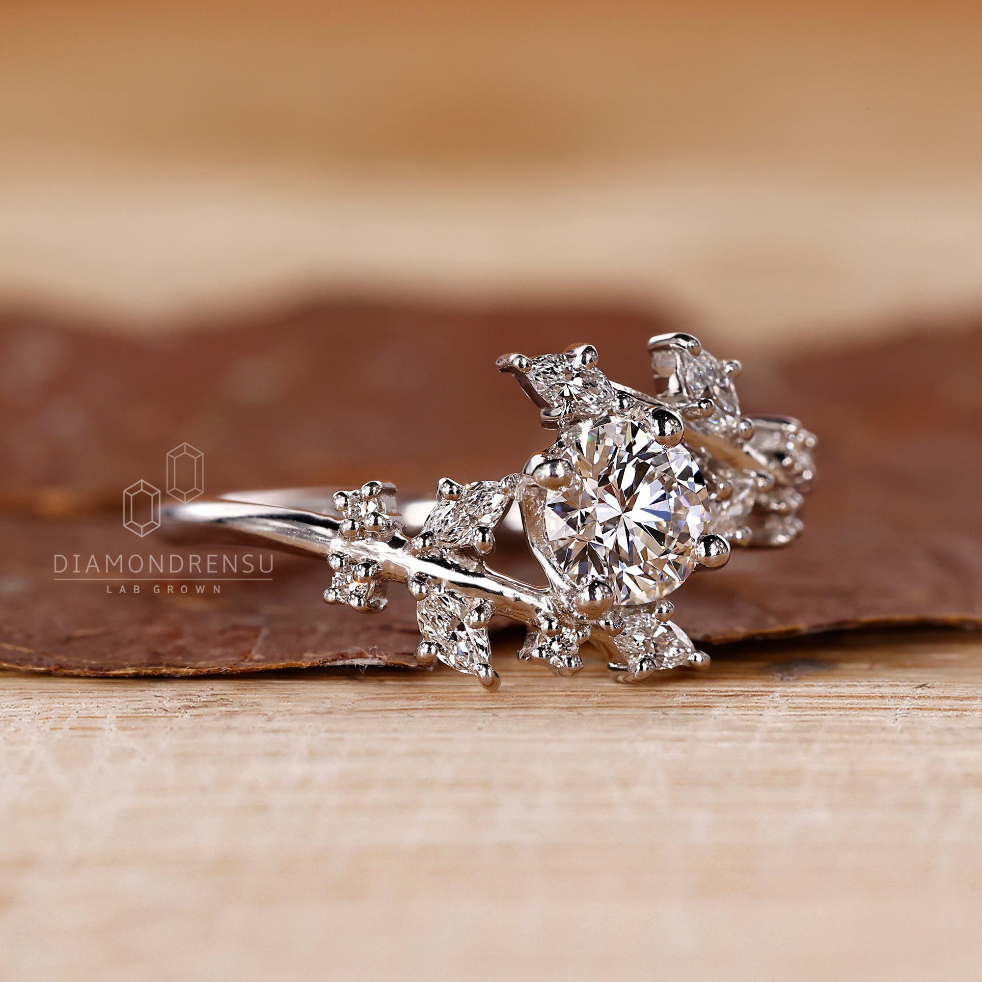 Round and marquise diamond ring in a bypass design.
