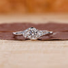 Three stone engagement ring with sparkling round cut diamonds.
