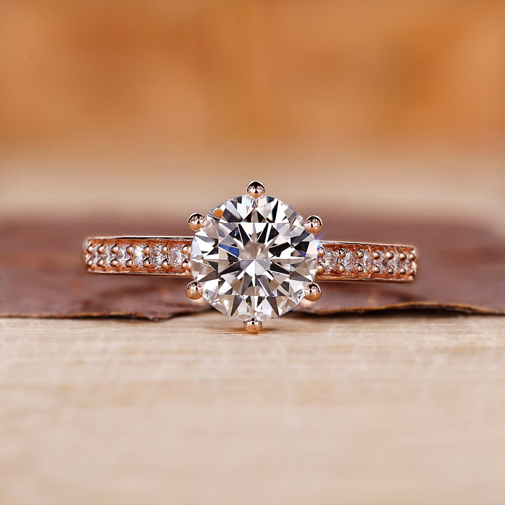 Round cut diamond ring set in a classic 6 prong ring setting on rose gold.
