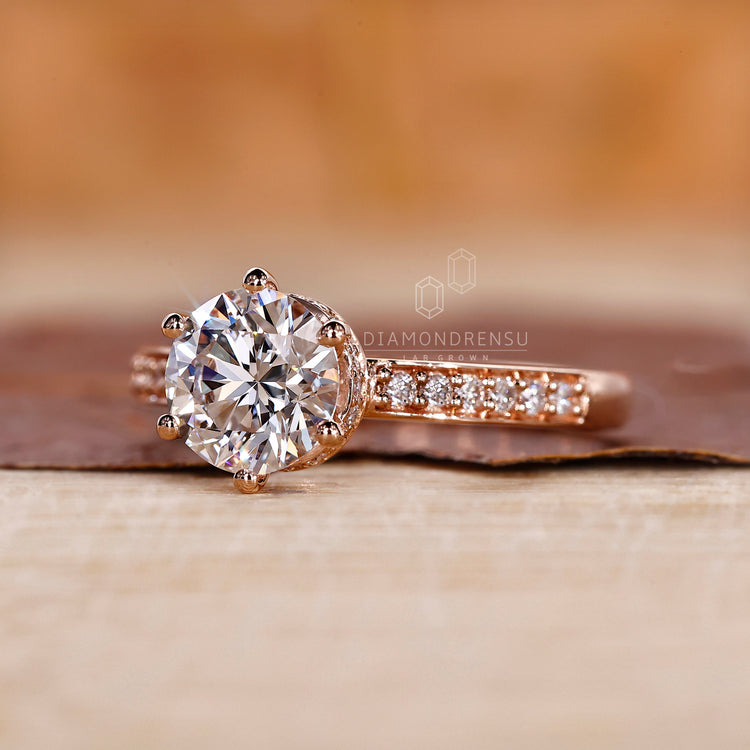 Handmade ring designed with a round cut diamond and hidden halo.
