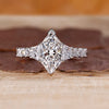 Dutch Marquise diamond ring with trapezoid side stones.
