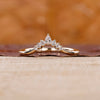 7 stone diamond band crafted in yellow gold with a prong setting.