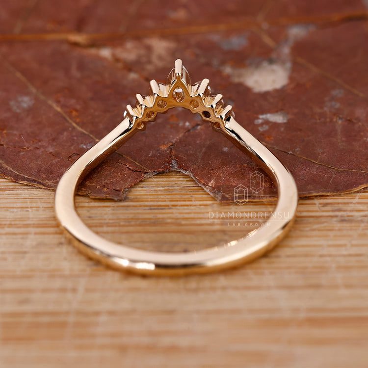 Handmade band with pear shaped diamonds and round accents.