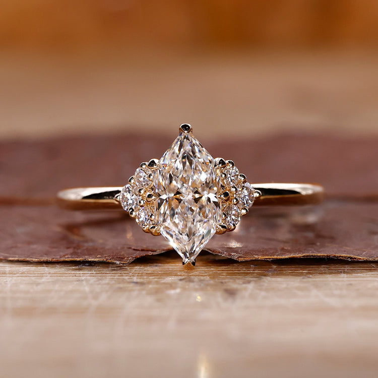 Yellow Gold Ring with dutch marquise diamond center stone.
