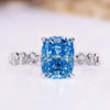 Cushion cut blue lab grown diamond ring with pave band.