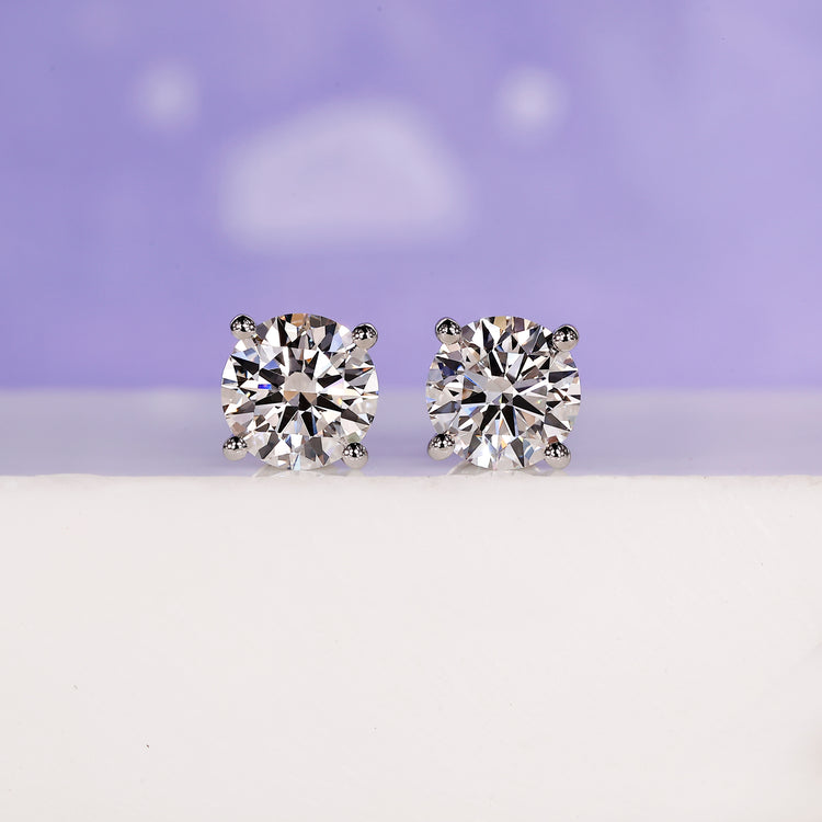 3 carat round diamond stud earrings.
