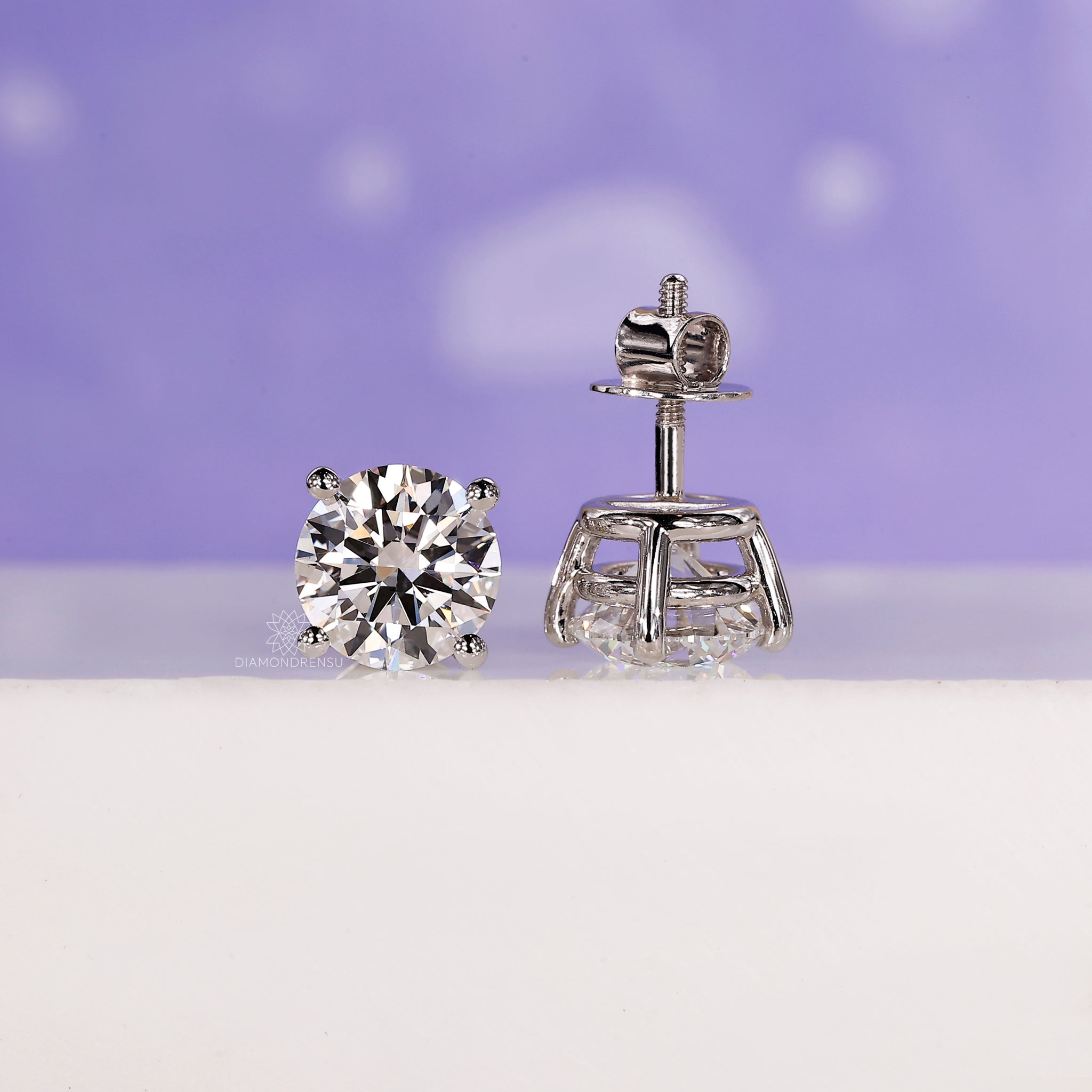 Four prong diamond setting earrings.
