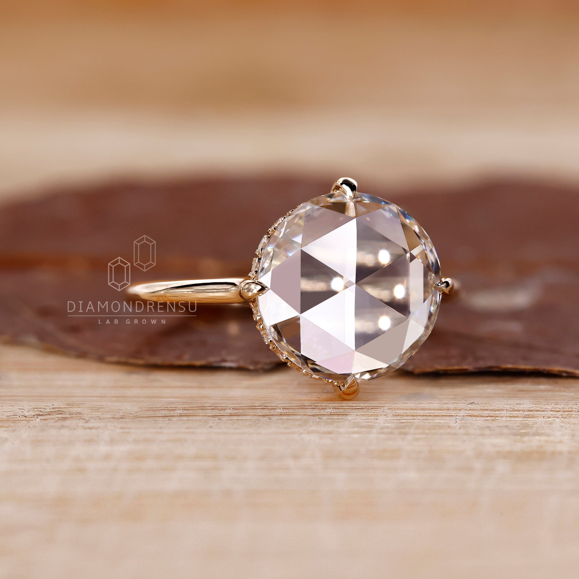 Yellow gold diamond ring with a round rose cut.
