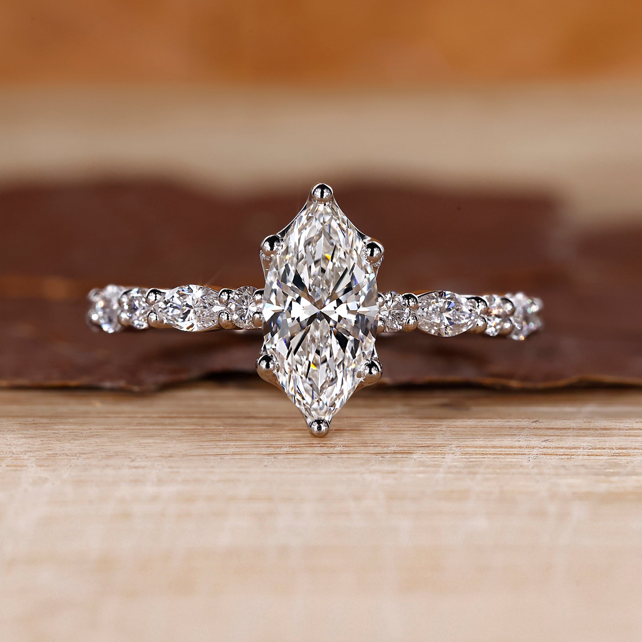 Marquise diamond ring with shared prong setting.

