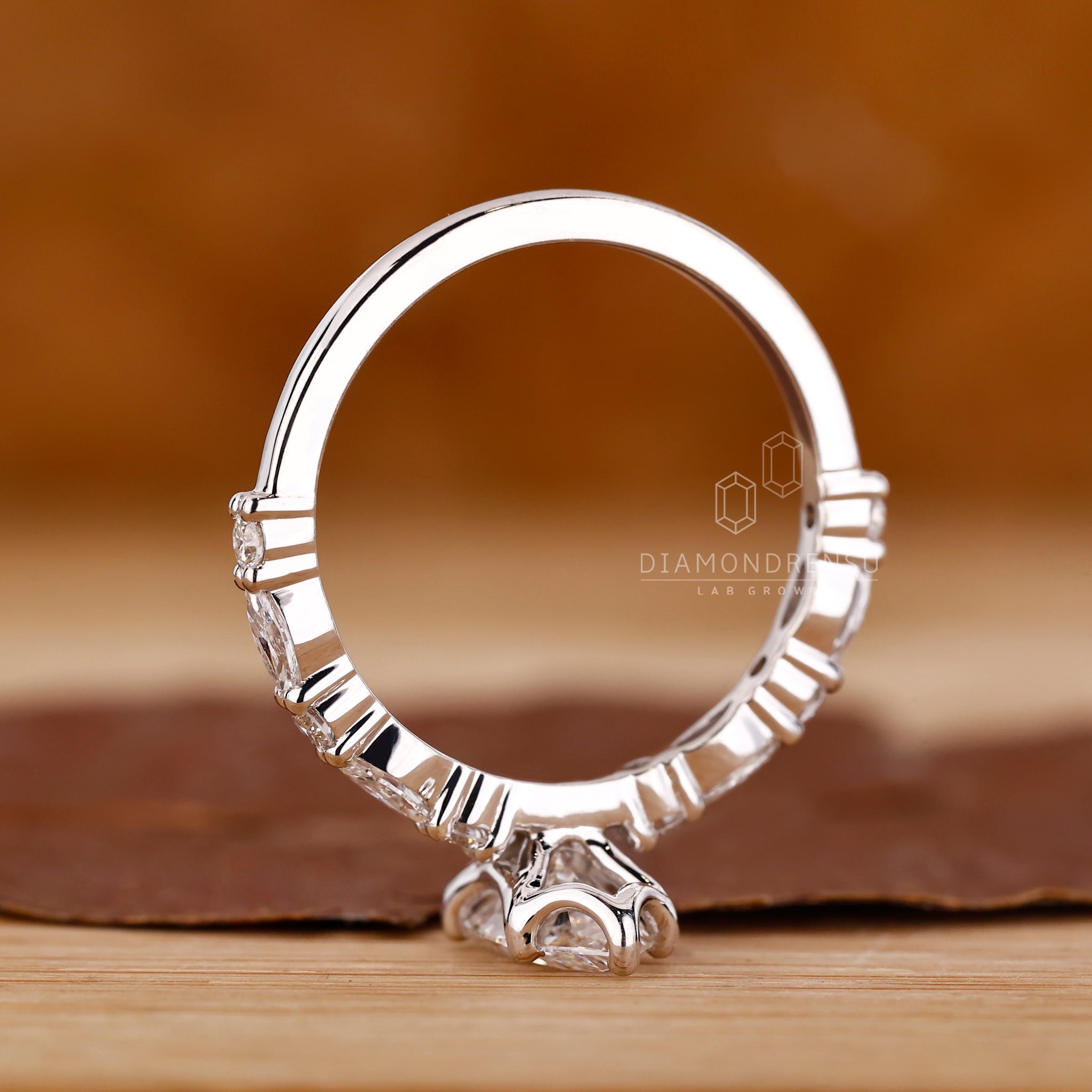 Unique ring featuring marquise and round lab grown diamonds.
